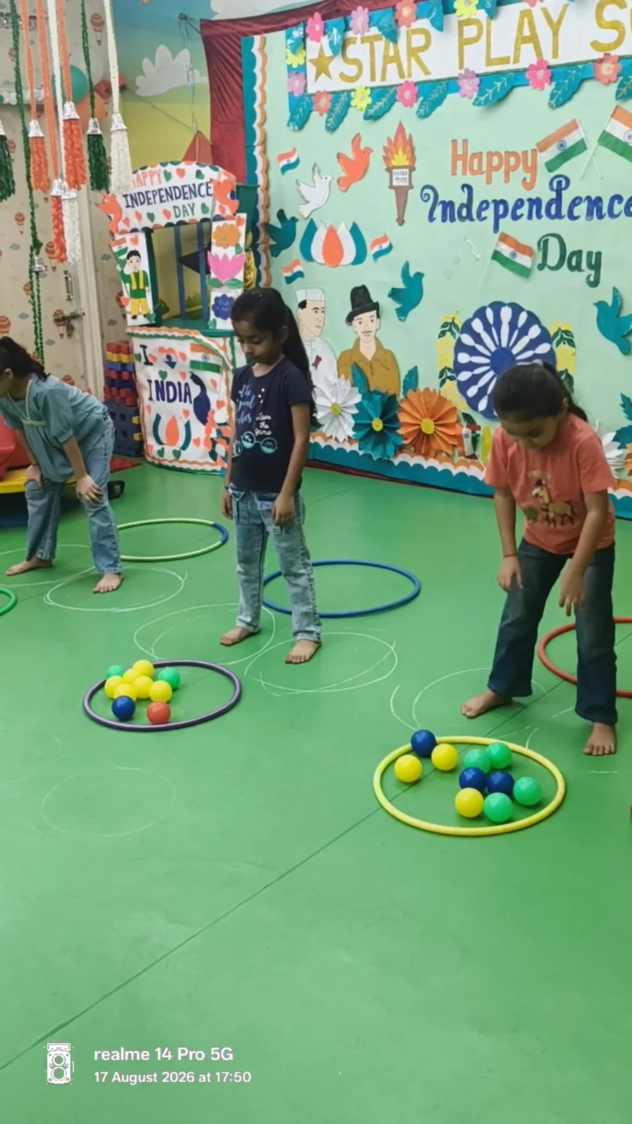 Children playing a hoop and ball game